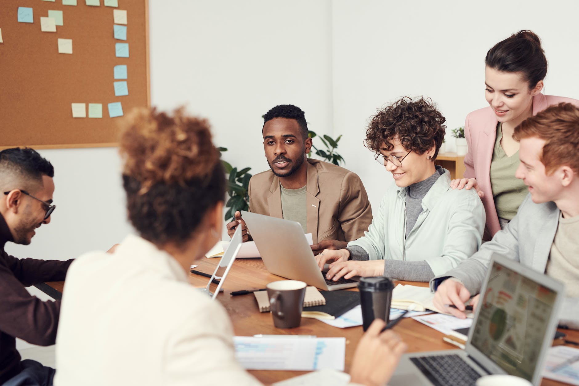 man wearing brown suit jacket - workplace wellness