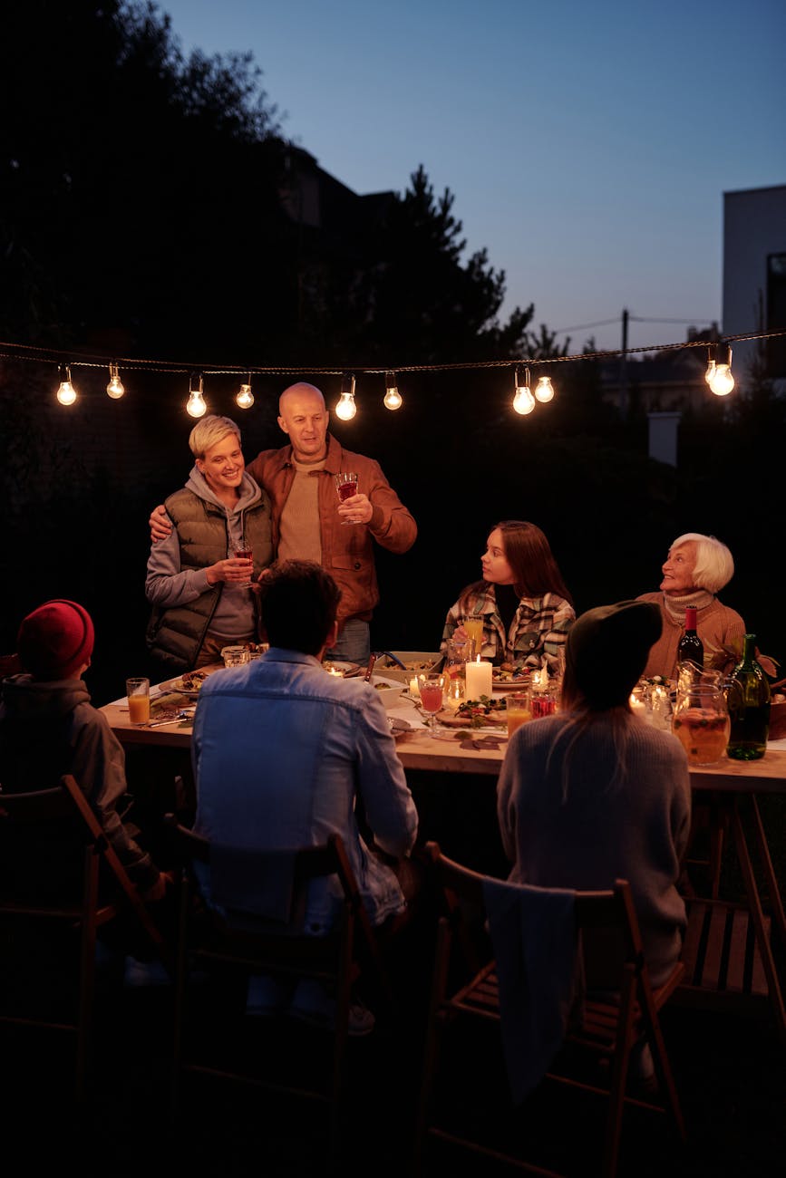 photo of a family sitting together in the backyard