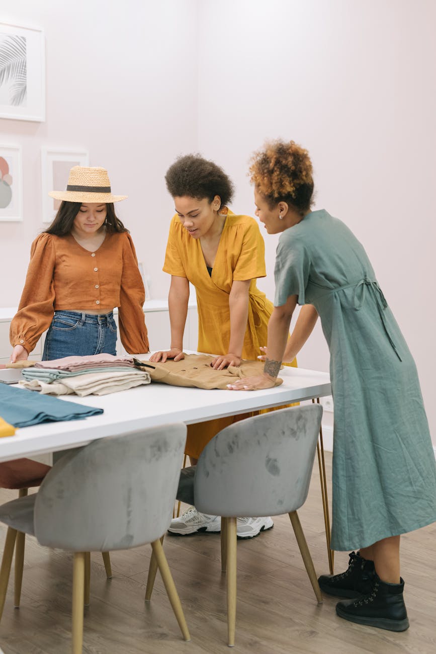 women at the table looking on the clothes