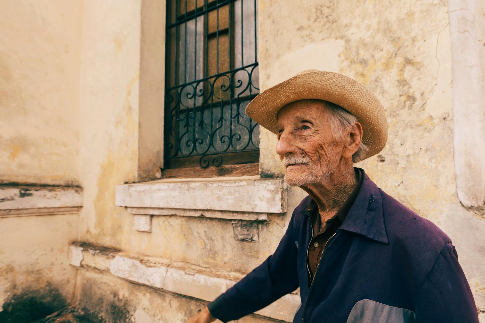 elderly man wearing a hat