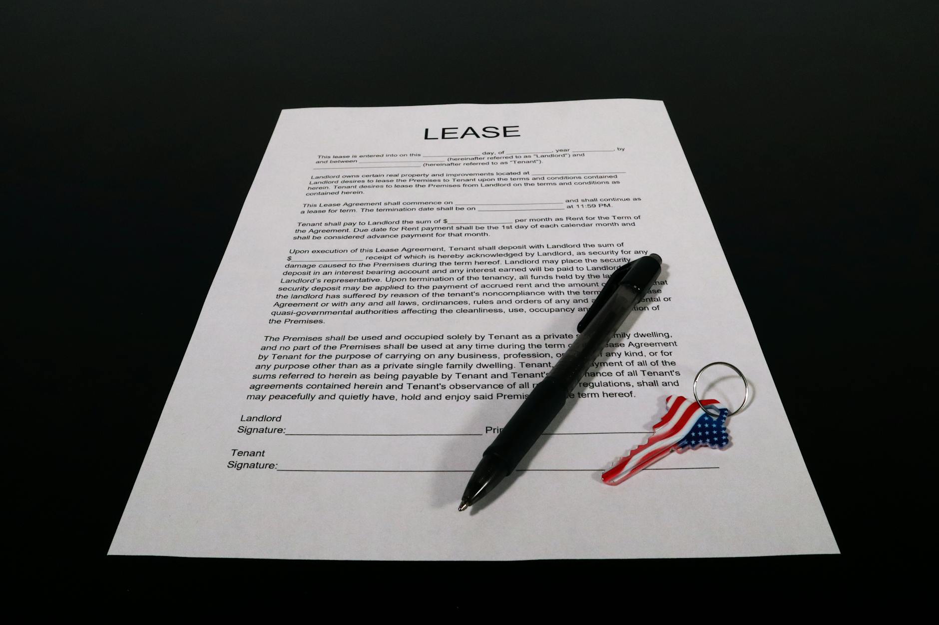 lease agreement document with pen and keychain