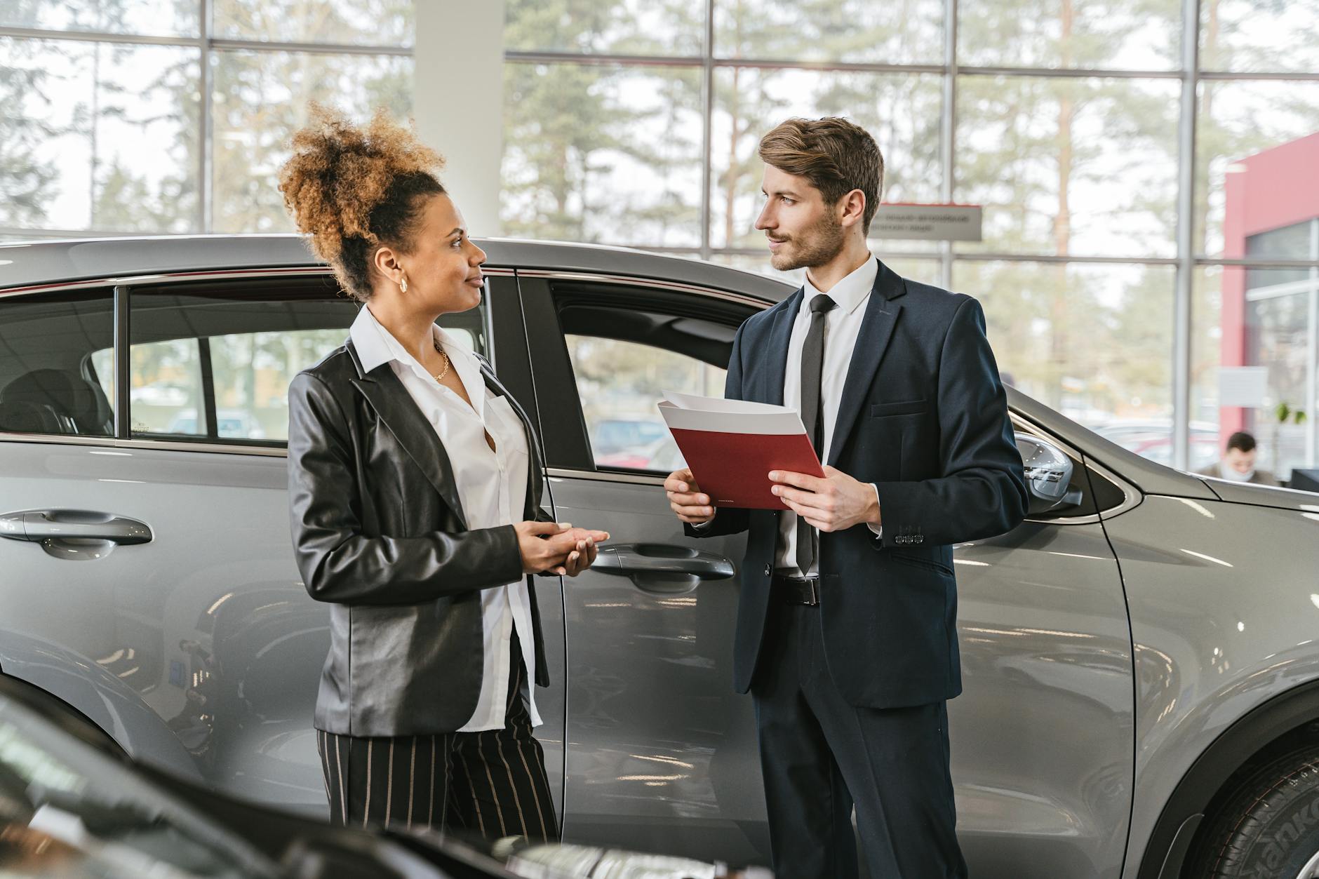 a woman buying a car