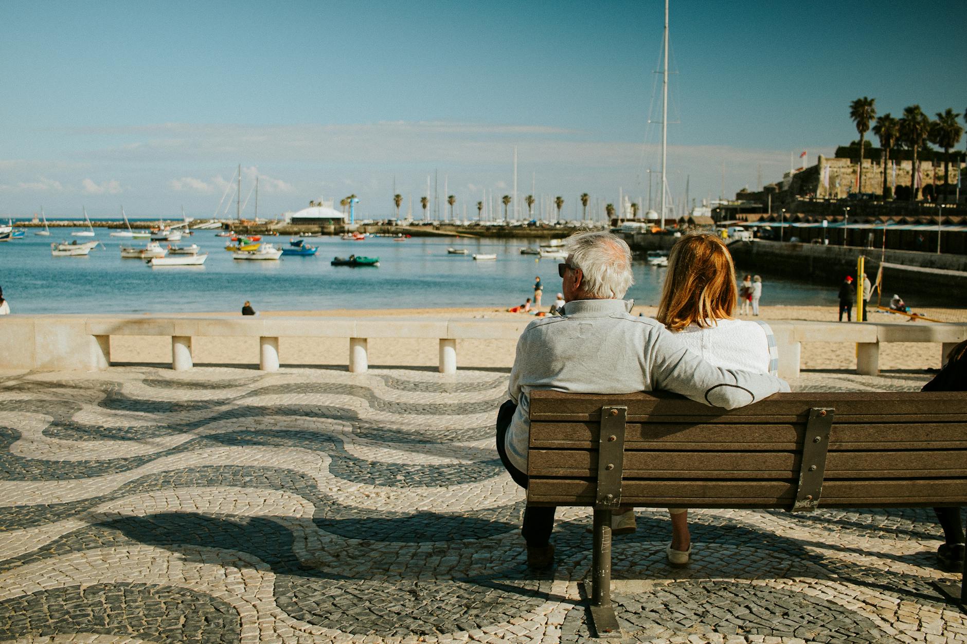 elderly couple enjoying scenic cascais waterfront
