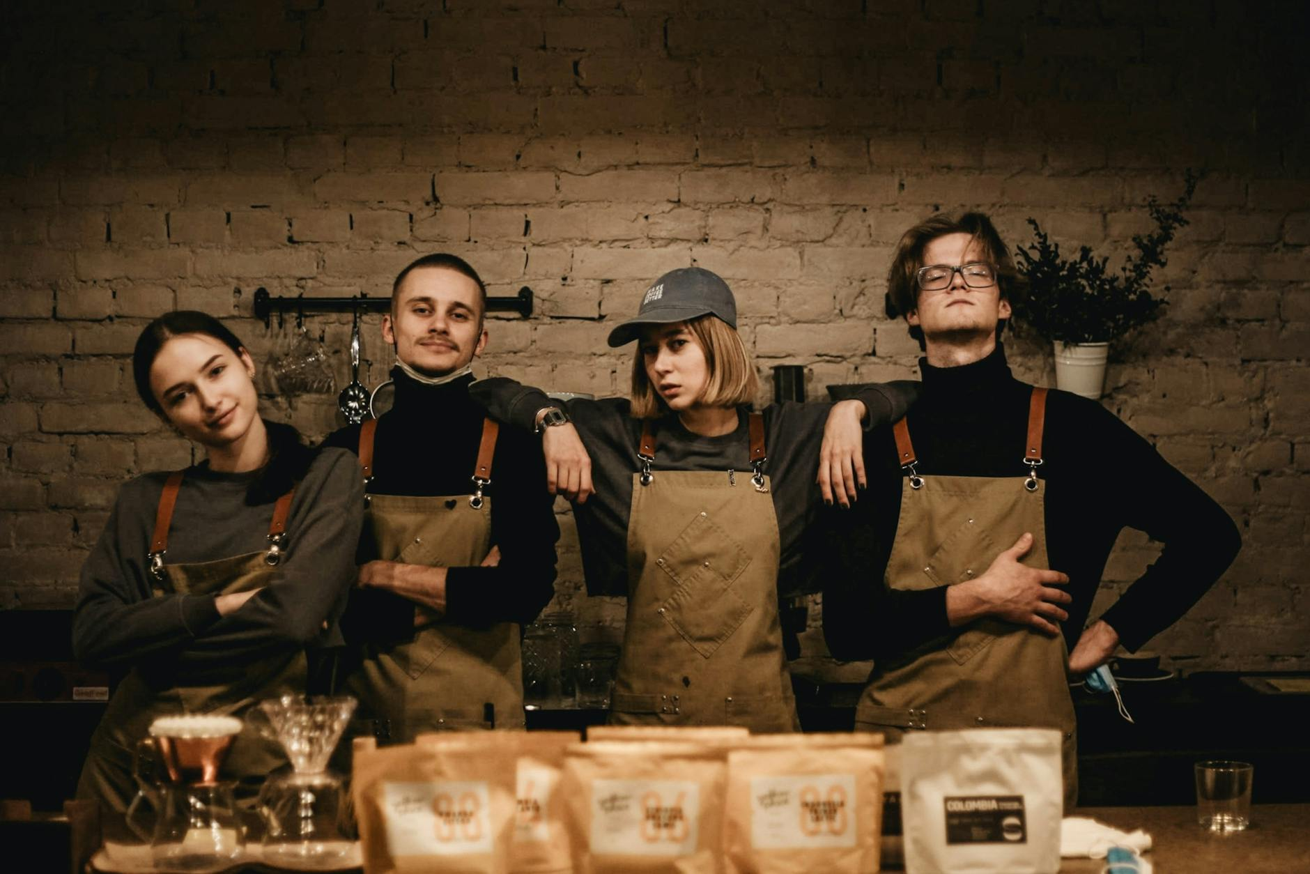 baristas wearing brown apron